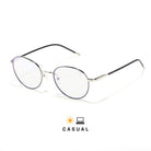 Lunettes anti lumière bleue rondes en métal argenté, cerclage argent foncé, branches marrons, sur fond blanc